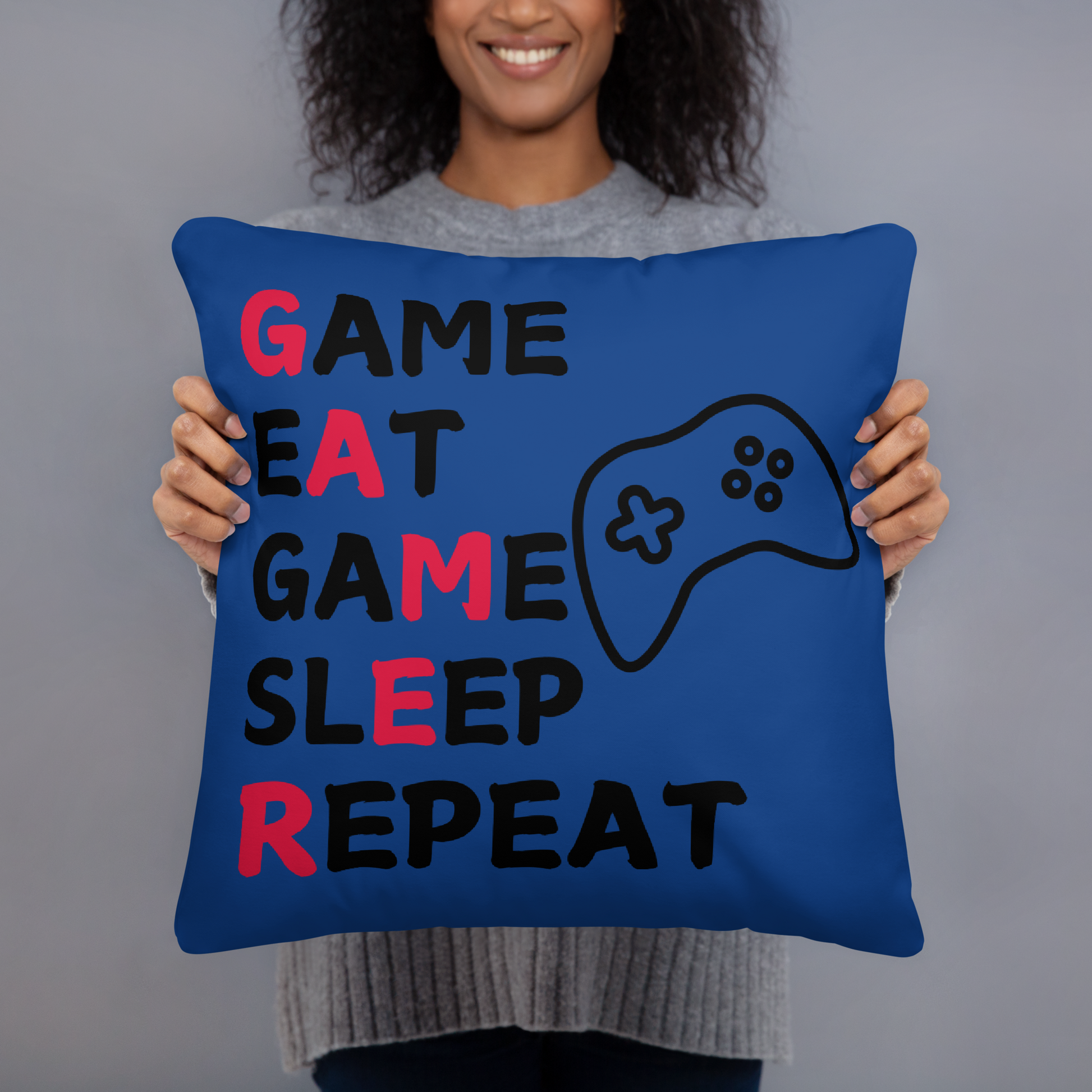 game eat sleep repeat logo on blue pillow