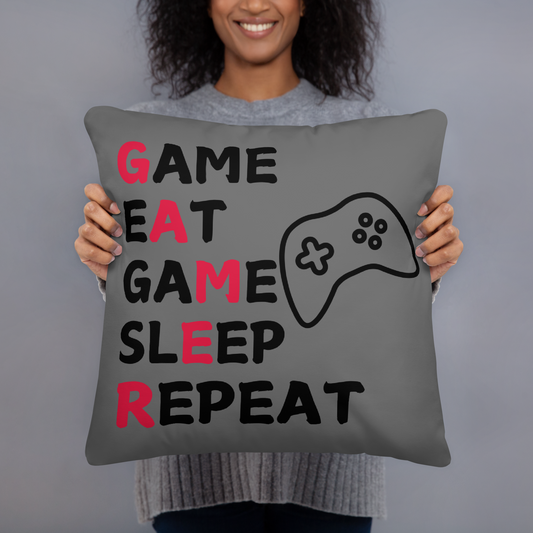 game eat sleep repeat logo on dark grey pillow