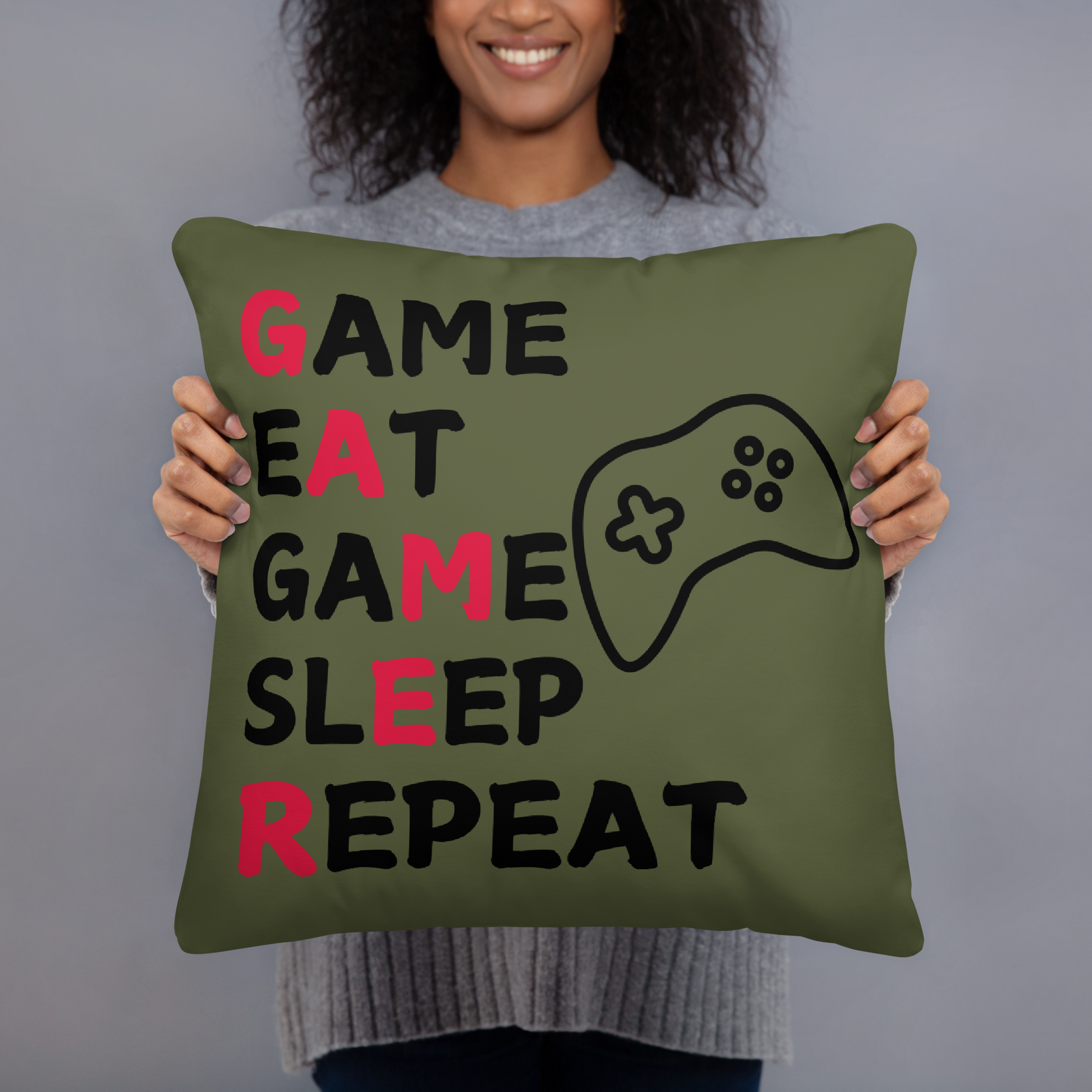 game eat sleep repeat logo on dark green pillow