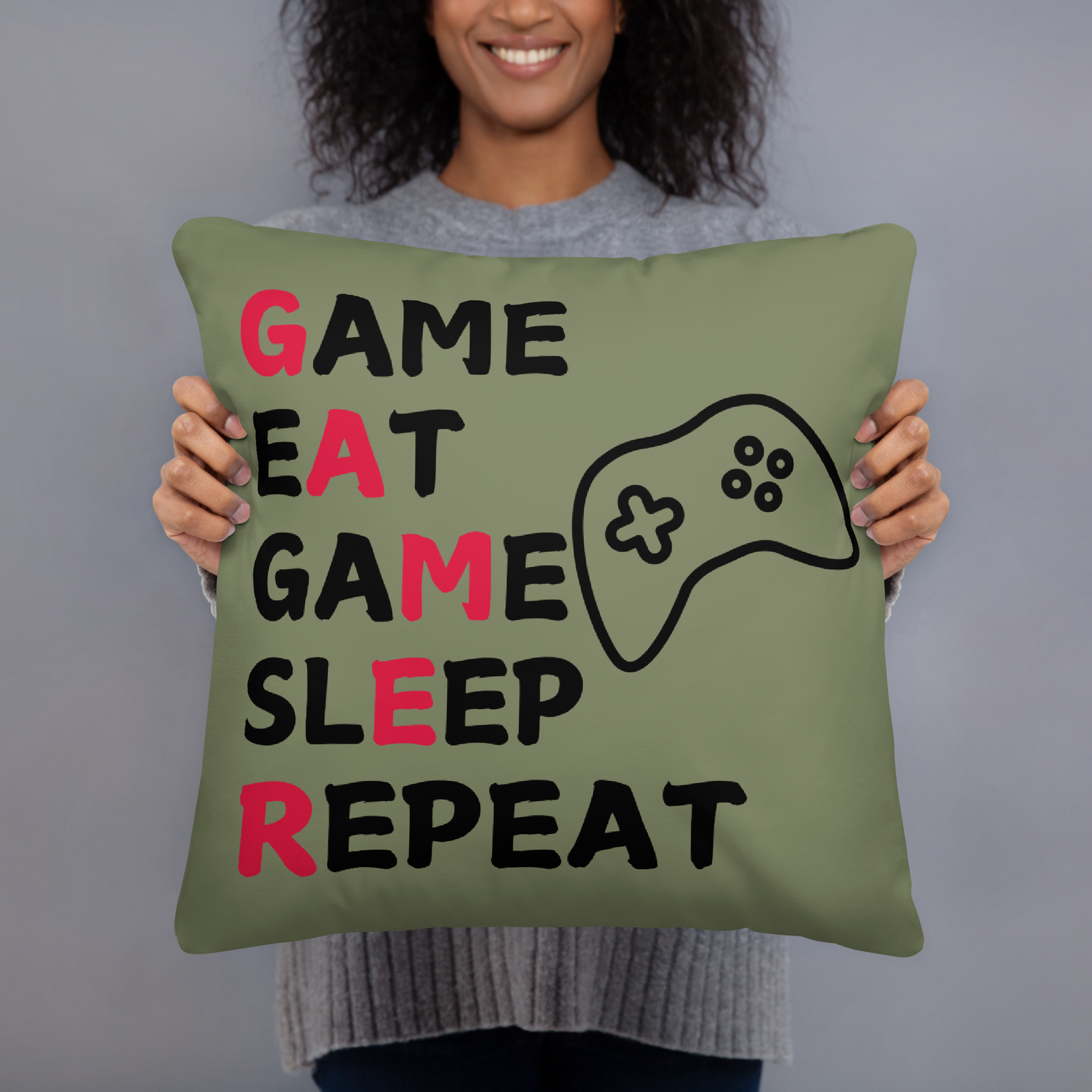 game eat sleep repeat logo on green pillow