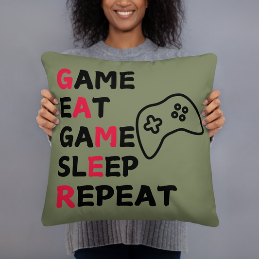 game eat sleep repeat logo on green pillow