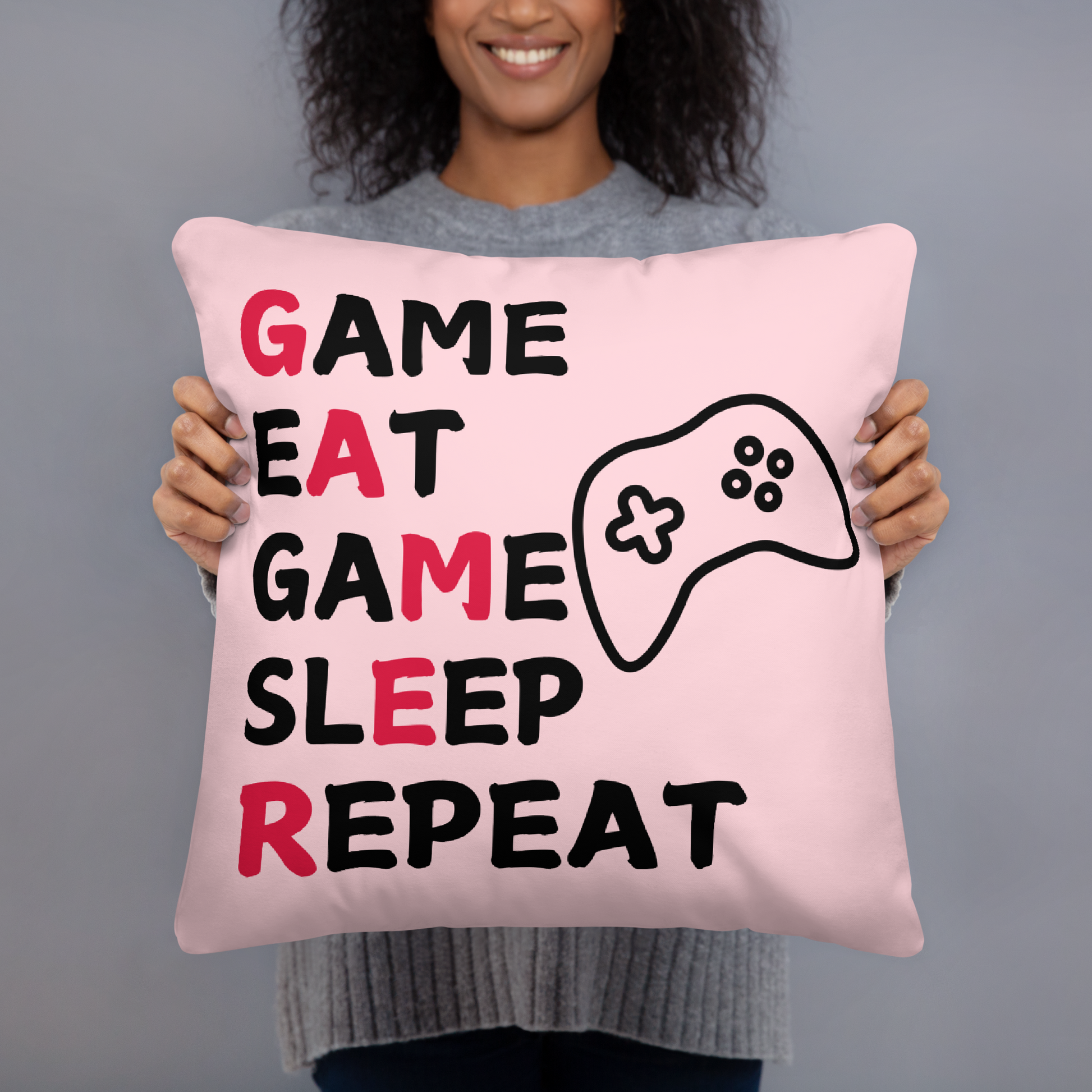 game eat sleep repeat logo on light pink pillow