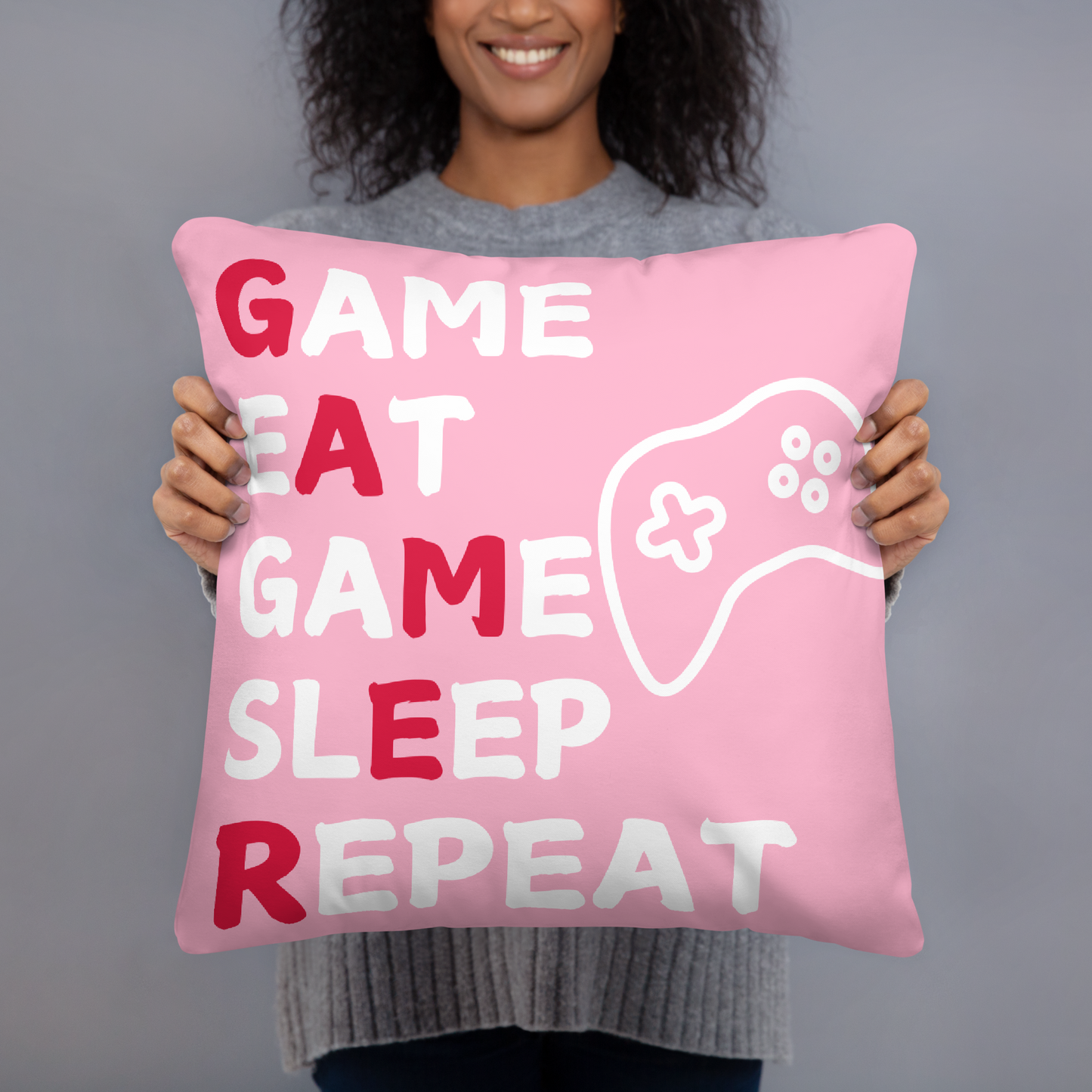 game eat sleep repeat logo on pink pillow