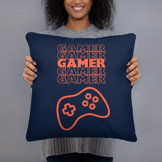 Blue pillow with the word Gamer repeated 5 times in orange and an image of an orange-colored game controller