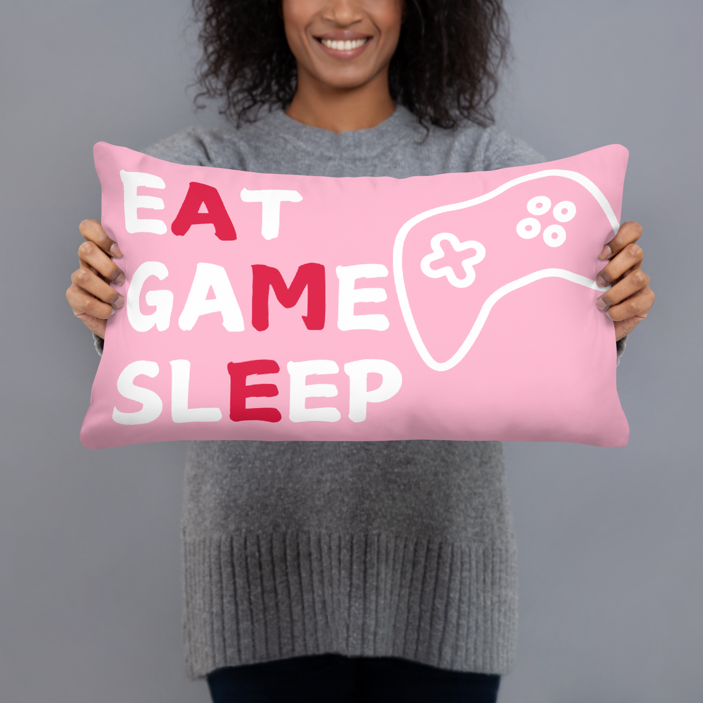 game eat sleep repeat logo on pink pillow