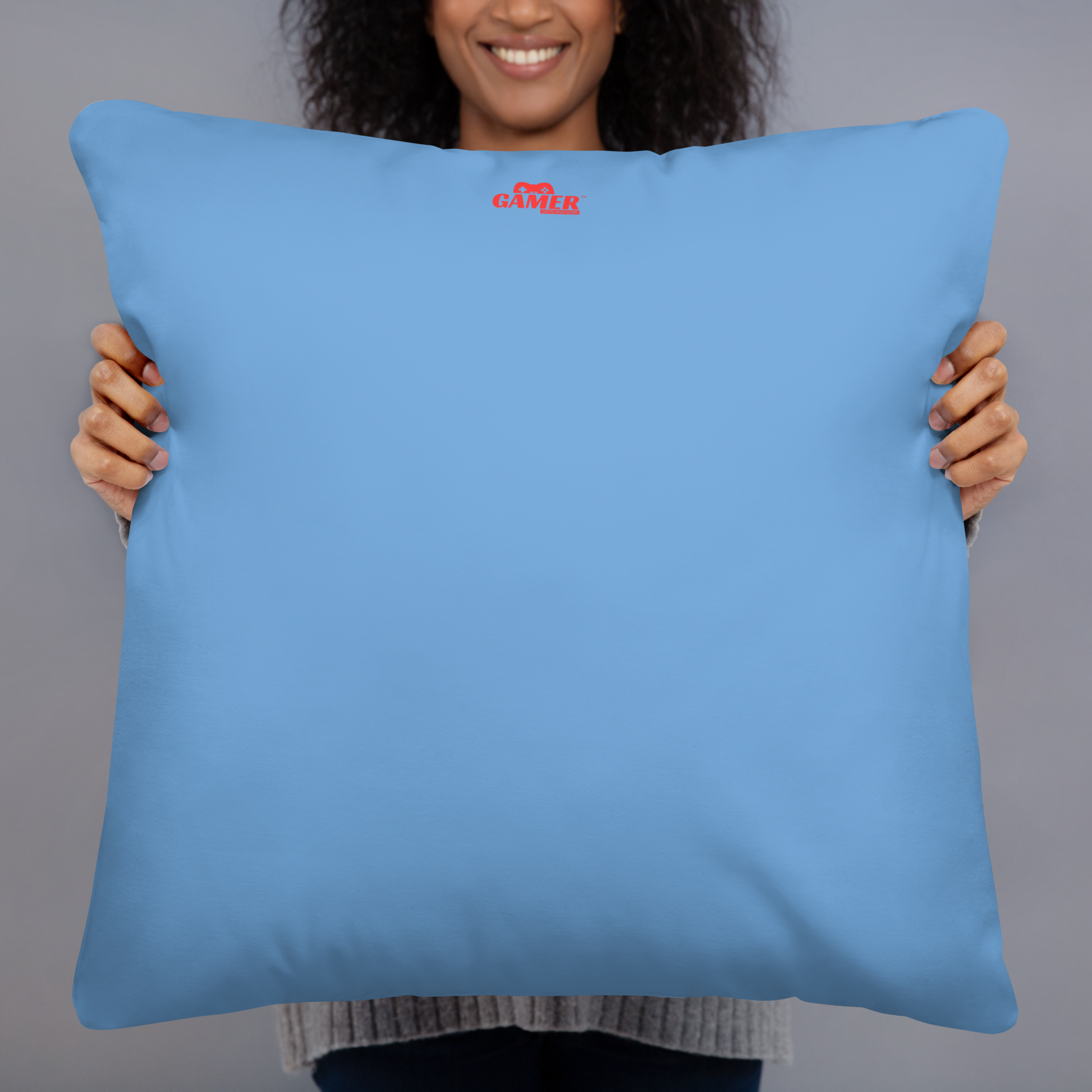 Gamer Gifts and Gear logo on back of bright blue pillow