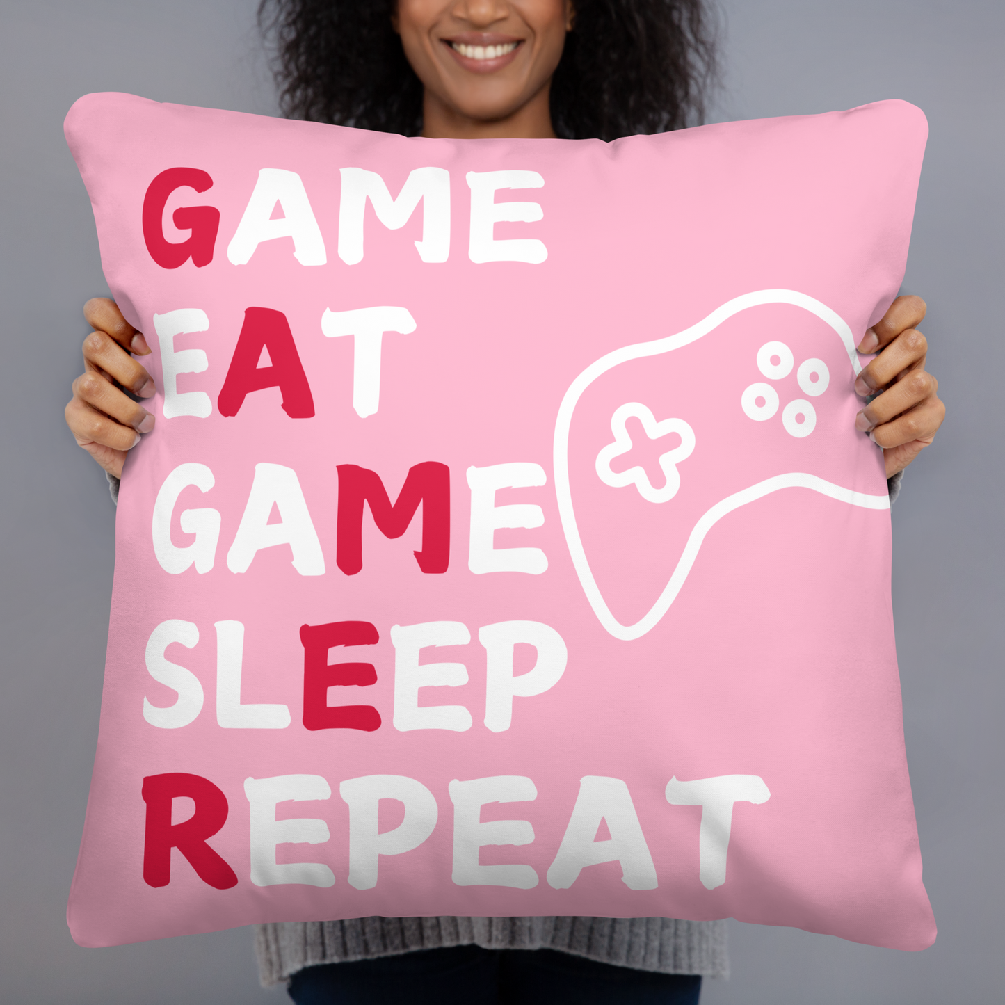 game eat sleep repeat logo on pink pillow