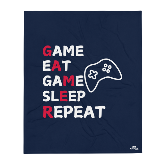 Game Eat Game Sleep Repeat wording and black game controller logo on blue throw blanket