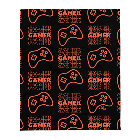 Black blanket with the word Gamer repeated 5 times in orange with an orange game controller - all in a repeated pattern, with small orange Gamer Gifts and Gear logo